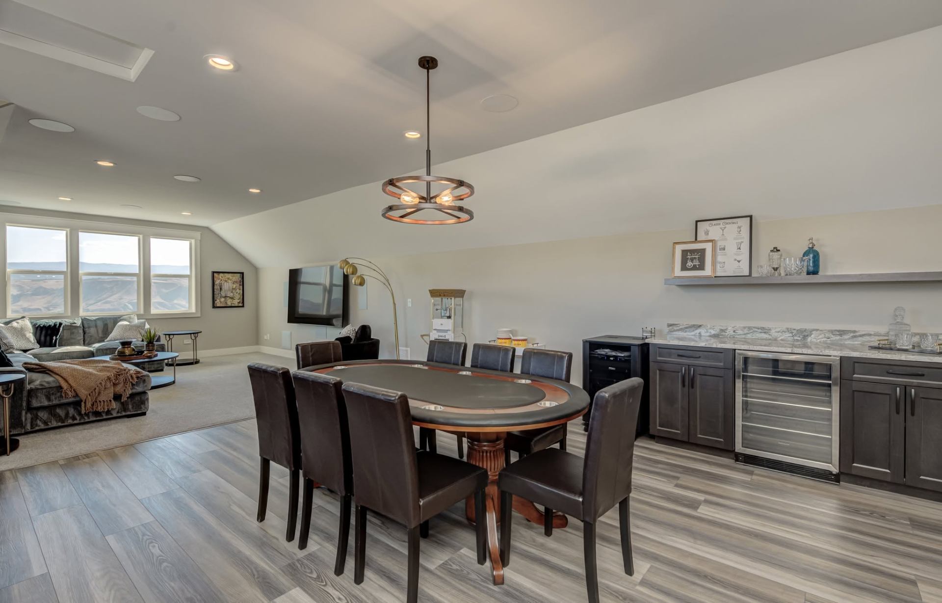 Finished bonus room with wet bar and lounge seating in a Wenatchee custom home