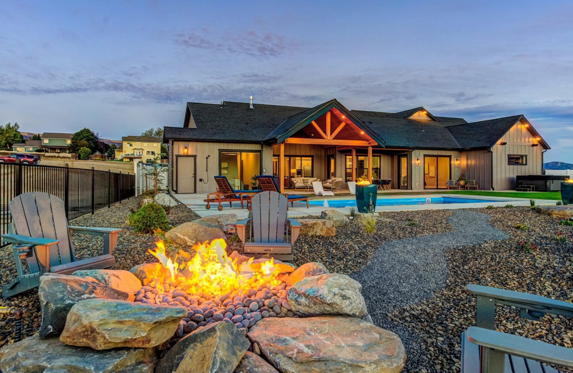 Outdoor firepit and pool landscaping at a featured Wenatchee Valley tour home