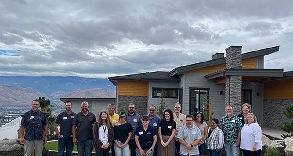 Building NCW members gathered outside a home tour stop
